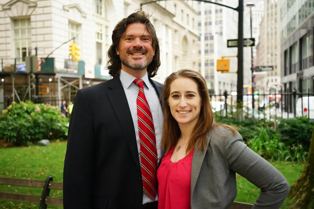 Founding partner/ Attorney of The Shapiro Law Firm, Aaron Shapiro standing next to Partner/ Chief Marketing Officer Amanda Shaffer