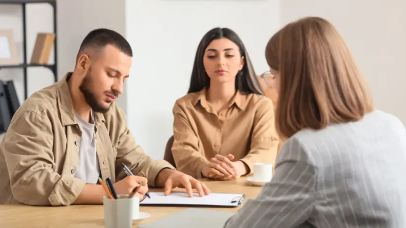 Couple engaged in a mediation session for divorce discussions