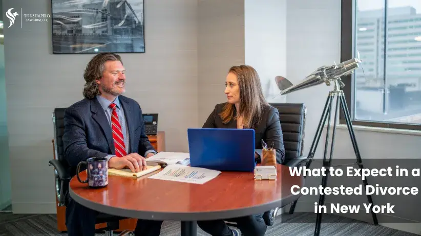 Attorneys Aaron Shapiro and Amanda Shaffer discussing a case in their office